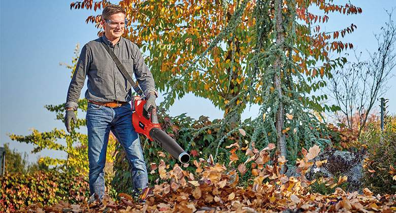 man working with a leaf blower